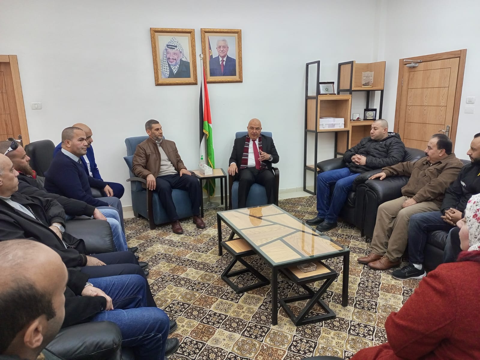 Nidal Al-Jaabari meets with the administrative body and staff working in the institution